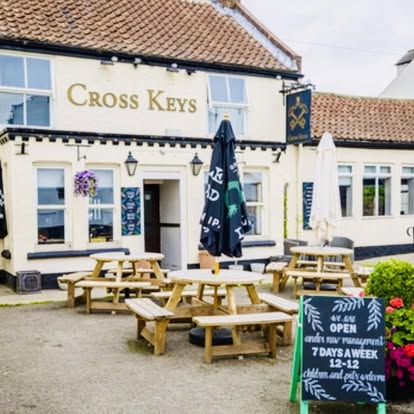 The Cross Keys pub front and beer garden